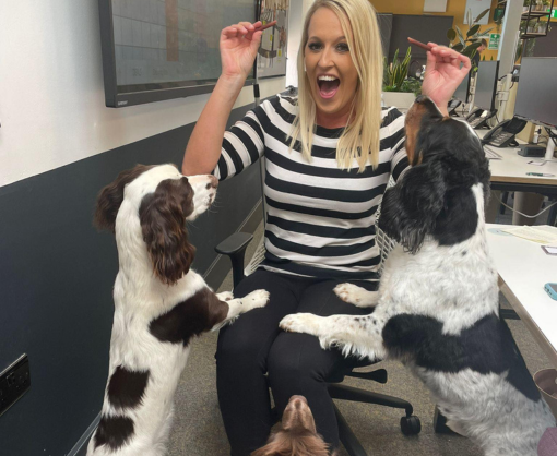 Employee, Debbie Holden, with 3 dogs