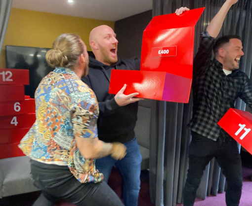 Employee, Adam Pickering, with a Deal or No Deal box