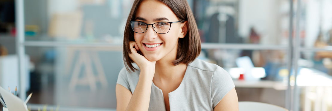  A lady wearing glasses smiling